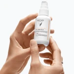 Vichy Солнцезащитный невесомый флюид против признаков фотостарения кожи лица с универсальным тонирующим пигментом, SPF 50+ Capital Soleil UV-Age Daily - фото N7